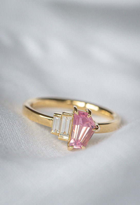 Art Deco inspired Natural Freeform cut Pink Sapphire & Baguette Diamonds ring on a white background