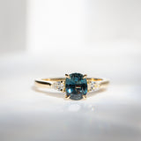 Daintree | 'Four Seasons' | Madagascan Teal Sapphire & Pear Diamonds Trilogy Ring made with 18K yellow gold in daylight