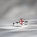 Kimberley | 'Pantai Merah' | Padparadscha Sapphire Halo Ring front contrast light view