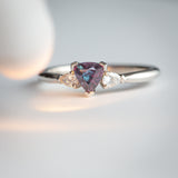 Daintree | "Urals I" | Natural Russian Alexandrite & Diamond Trilogy Ring colour change in warm light from a different angle