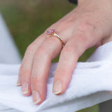 Kimberley | Pink Sunrise - Vivid Pink Sapphire Solitaire on hand