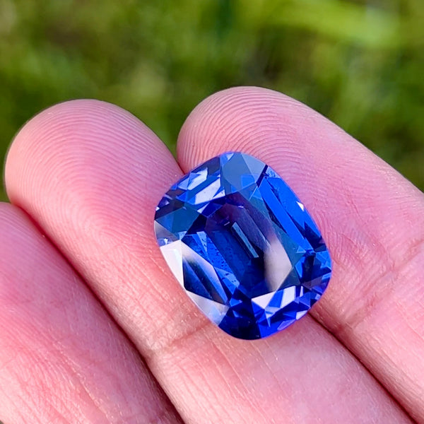 12.58Ct Blue-Violet Tanzanite | Cushion Shape on hand