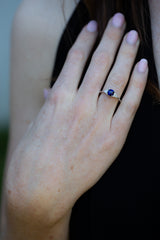 Royal Blue Sapphire & Diamonds Ring on engagement ring finger