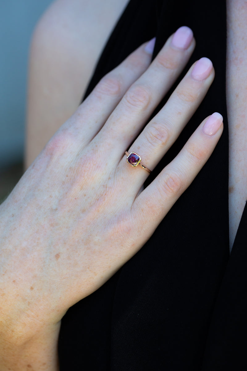 Art Deco Bezel Solitaire Neon Purple Sapphire Ring on ring finger