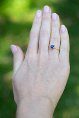 Solitaire Cushion Royal Blue Sapphire Ring on hand
