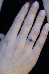 Solitaire Cushion Royal Blue Sapphire Ring on engagement ring finger