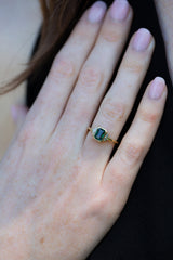 Art deco ring with  Forest Green Teal Sapphire & Baguette Diamonds on ring finger