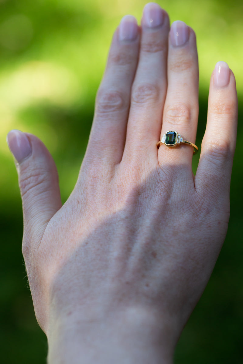 Art deco ring with  Forest Green Teal Sapphire & Baguette Diamonds on hand