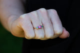 Vivid Pink & Forest Green Teal Sapphires Ring on hand