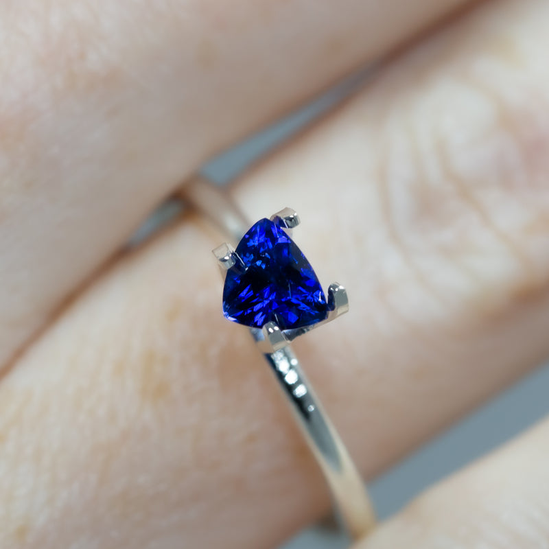 0.63Ct Royal Blue Ceylon Sapphire | Trillion Shape across finger