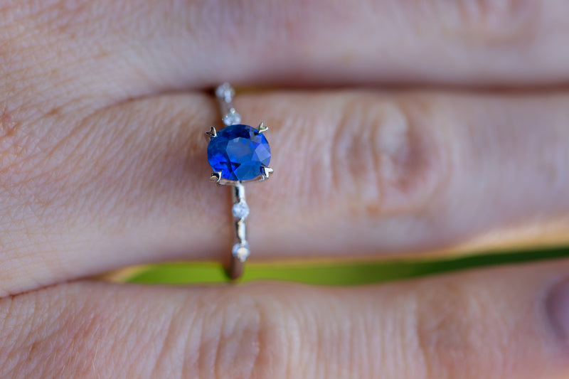 Close up of cornflower Blue Sapphire & Diamonds Ring