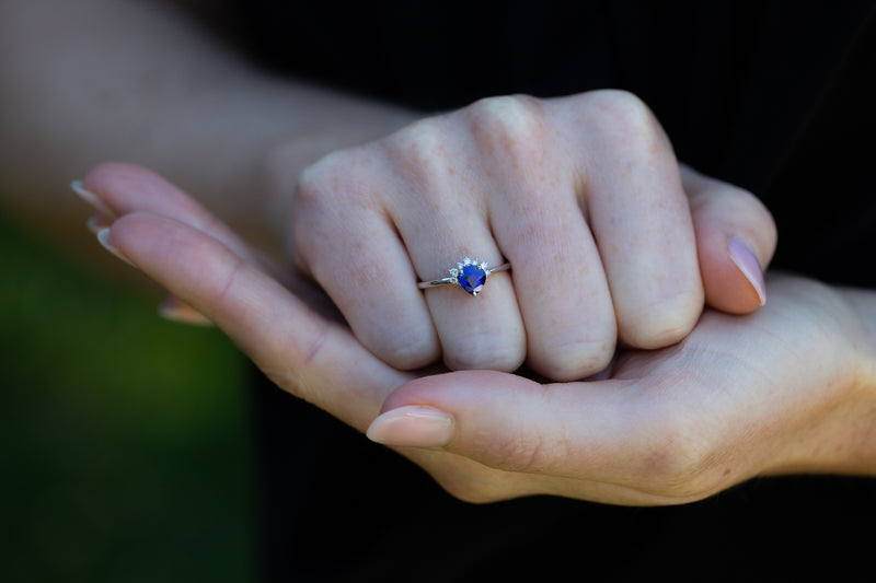 Royal Blue Sapphire & Diamonds Ring on supported hand