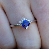 Close up of Royal Blue Pear Sapphire & Diamonds Ring on finger