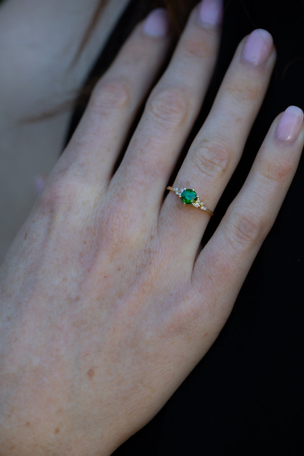 Emerald Green Tsavorite & Diamonds Ring on ring finger