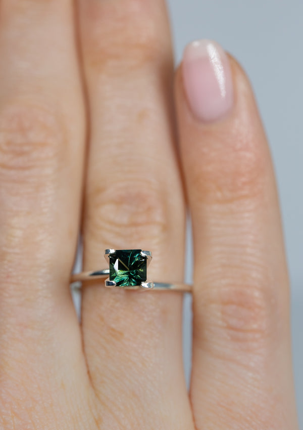 Magical 1.12Ct Blue Green Teal Sapphire | Emerald Shape from Madagascar on ring finger