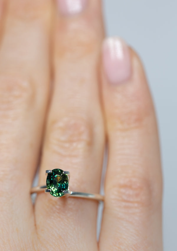 beautiful 1.39Ct Bluish Green Teal Sapphire | Oval Shape from Madagascar on ring finger