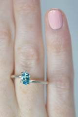 0.68Ct Neon Blue Paraiba Tourmaline | Oval Shape on hand