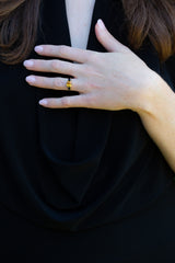 Golden Yellow Sapphire and dark spinel ring on model