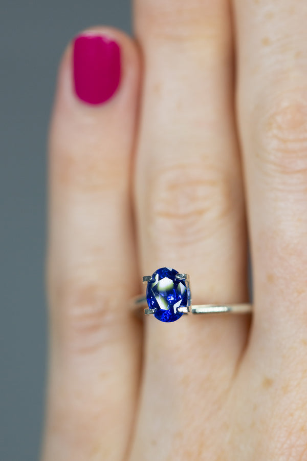1.55Ct Intense Cornflower Blue Ceylon Sapphire | Oval Shape on ring finger