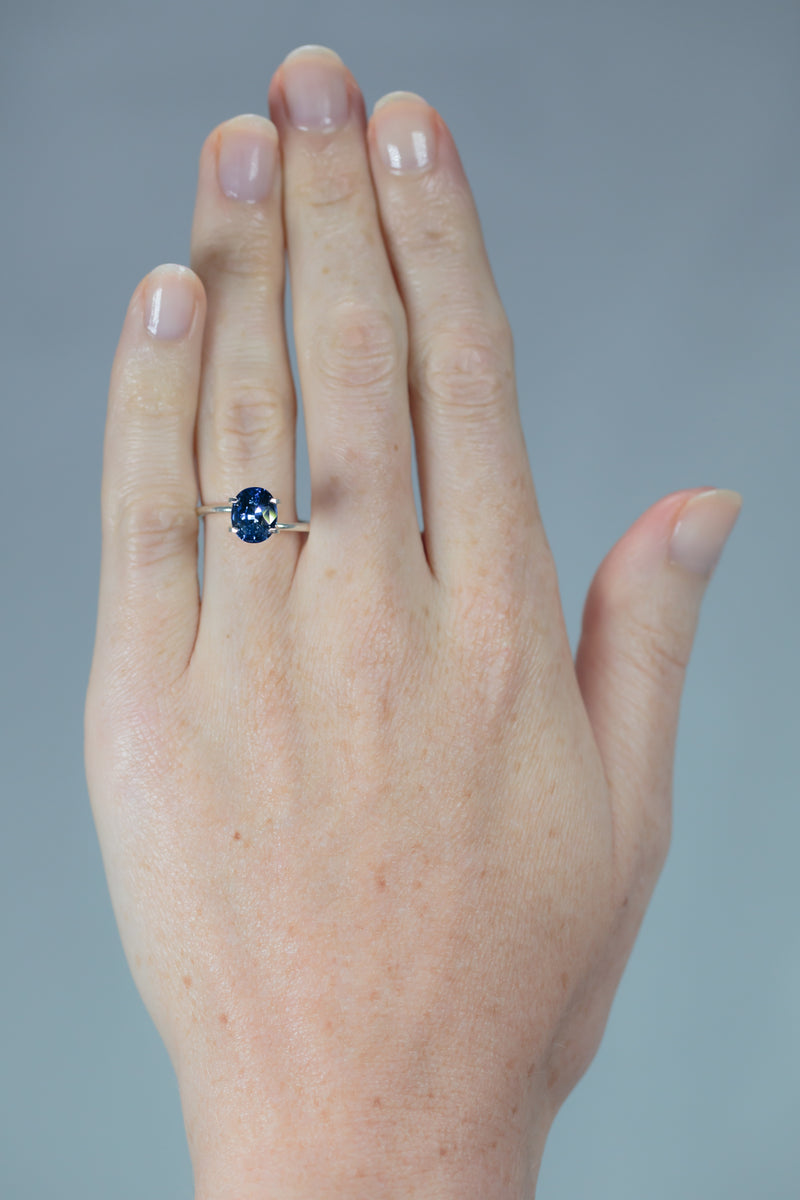 2.4Ct Sweet Blue Ceylon Sapphire | Oval Shape on hand