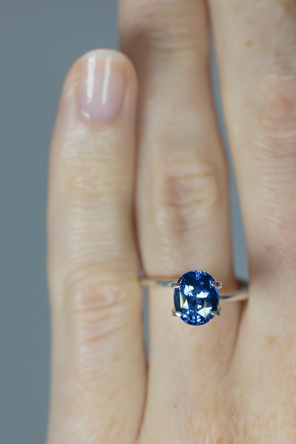 2.4Ct Sweet Blue Ceylon Sapphire | Oval Shape on ring finger