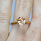 Natural, rare 1.73Ct Peach Orange Padparadscha Sapphire | Oval Shape from Sri Lanka on finger