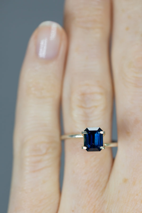 2.26Ct Vivid Blue (Basaltic) Madagascan Sapphire | Emerald Shape on ring finger