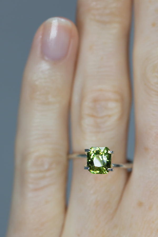2.32Ct Autumn Leaf Green Ceylon Sapphire | Emerald Shape on ring finger