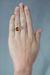 4Ct Deep Orange Brown Hessonite "Cinnamon" Garnet | Oval Shape on hand
