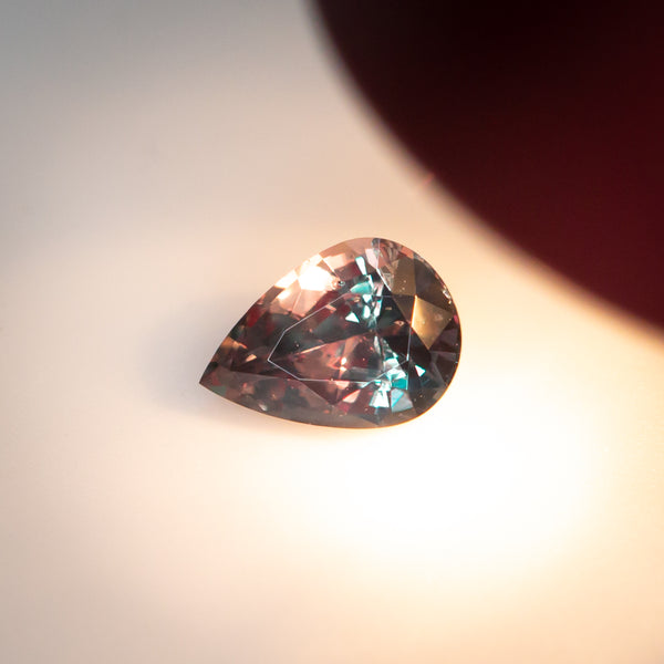 0.16Ct Bluish Green to Reddish Purple Alexandrite | "Petite Alexandra" | Pear Shape warm light view 3