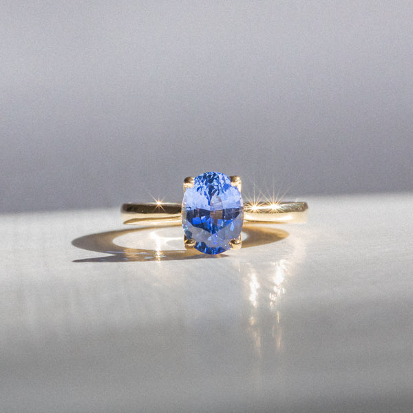 Indian Ocean | Vivid Blue Solitaire - Ceylon Sapphire Ring Front view in sun