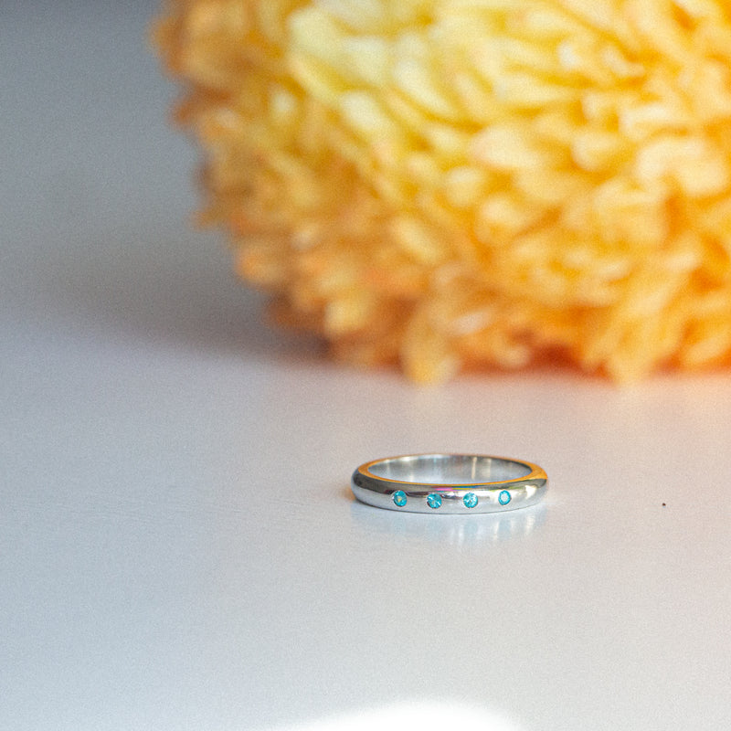 Indian Ocean | Paraiba Stacker - Neon Blue Paraiba Tourmaline on table
