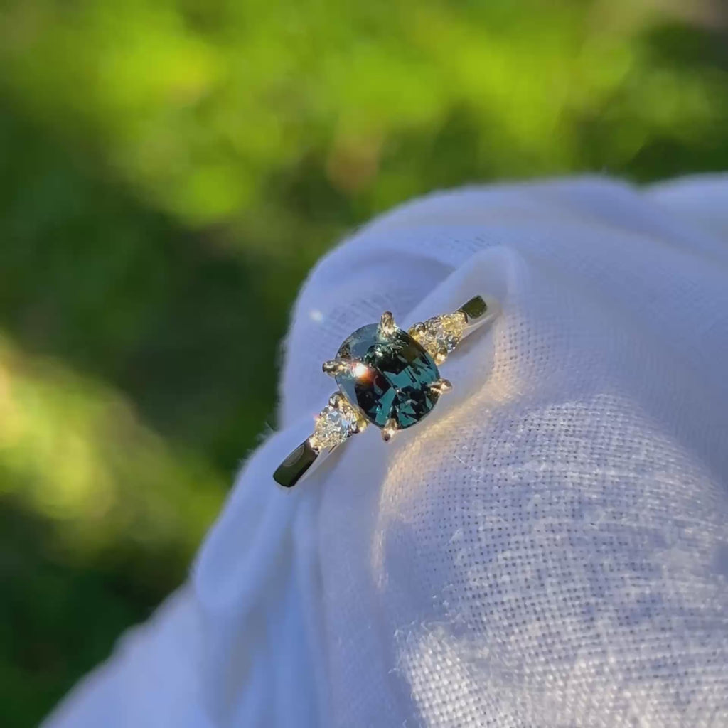 Daintree | 'Four Seasons' | Madagascan Teal Sapphire & Pear Diamonds Trilogy Ring made with 18K yellow gold in sunlight 2