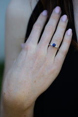 Royal Blue Sapphire & Diamonds Ring on engagement ring finger