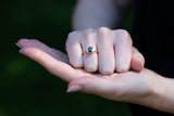 Art deco ring with  Forest Green Teal Sapphire & Baguette Diamonds on clenched fist