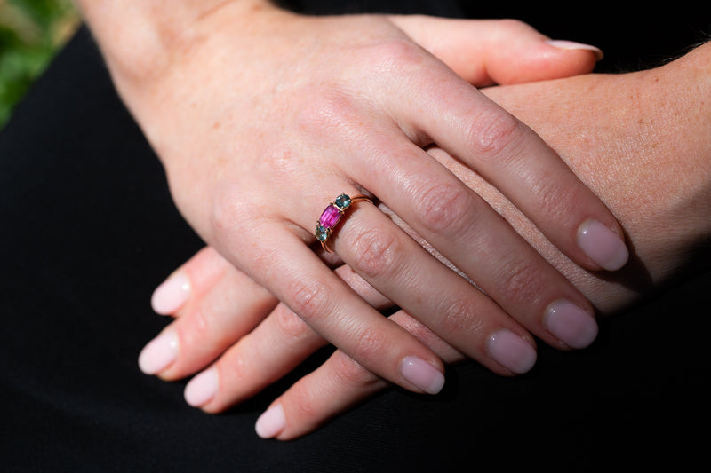 Vivid Pink & Forest Green Teal Sapphires Ring under sunlight