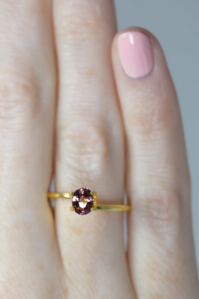 0.8Ct Sunset Orange Pink Ceylon Sapphire | Oval Shape on finger