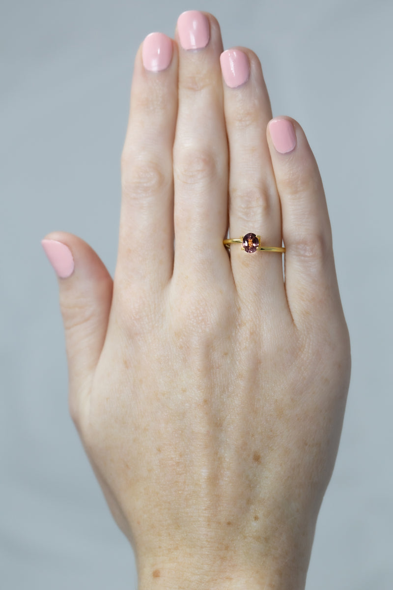 0.8Ct Sunset Orange Pink Ceylon Sapphire | Oval Shape on hand