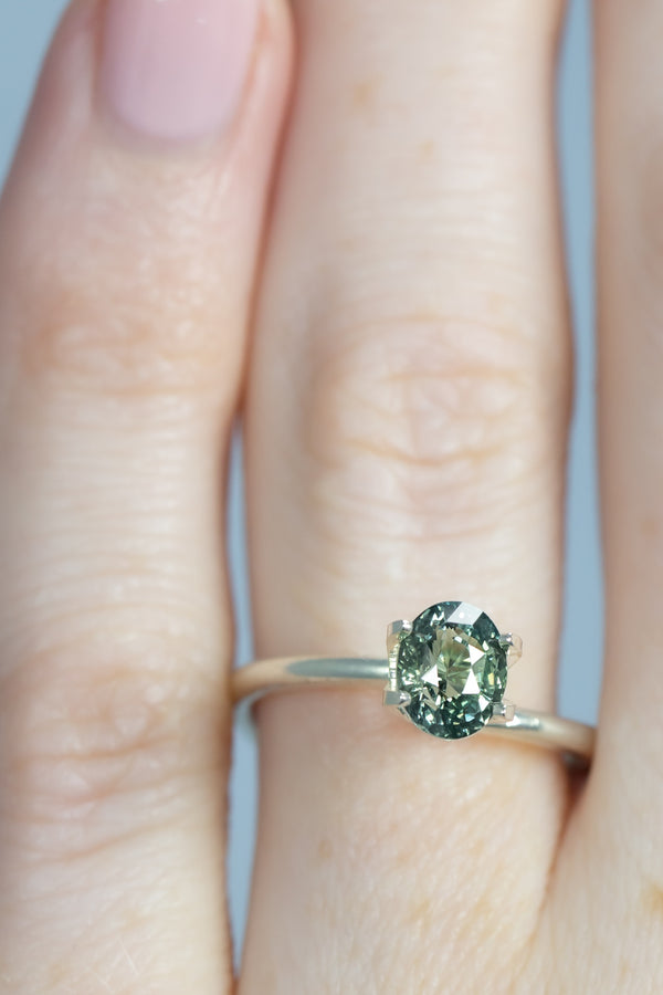 1.25Ct Light-Medium Blue Green Madagascan Sapphire | Oval Shape on finger