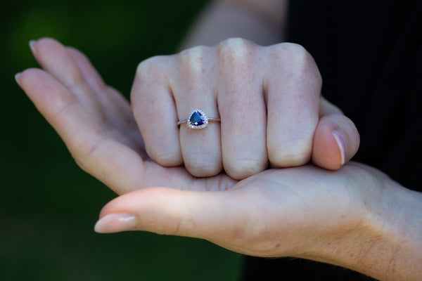 Royal Blue Trillion Sapphire & Diamonds Ring on supported hand