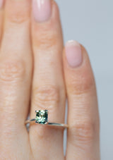 Lustrous 1.05Ct Blue Green Teal Sapphire | Cushion Shape from Madagascar on ring finger