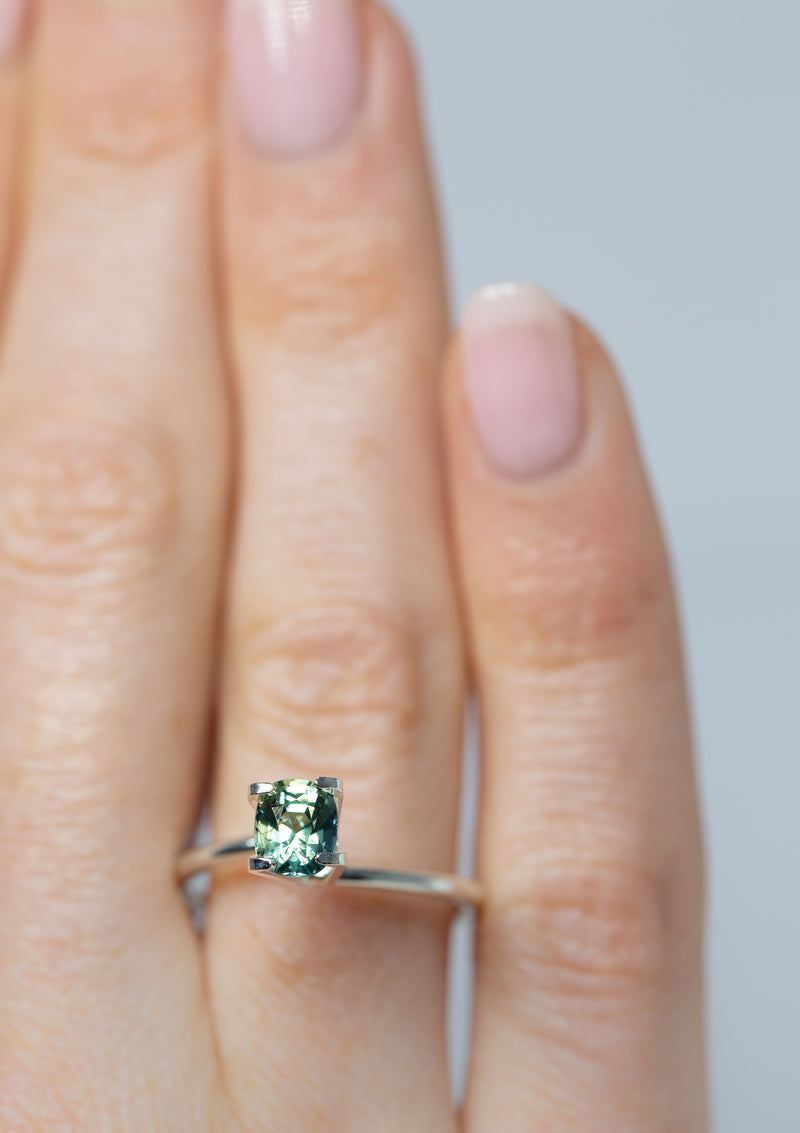 Lustrous 1.05Ct Blue Green Teal Sapphire | Cushion Shape from Madagascar on ring finger