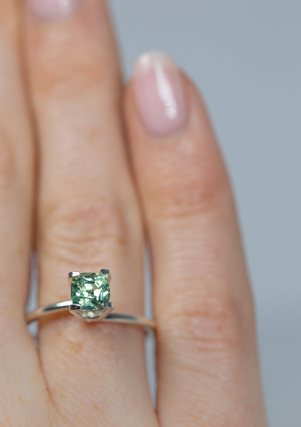 Lustrous 1.03Ct Blue Green Teal Sapphire | Cushion Shape from Madagascar on ring finger