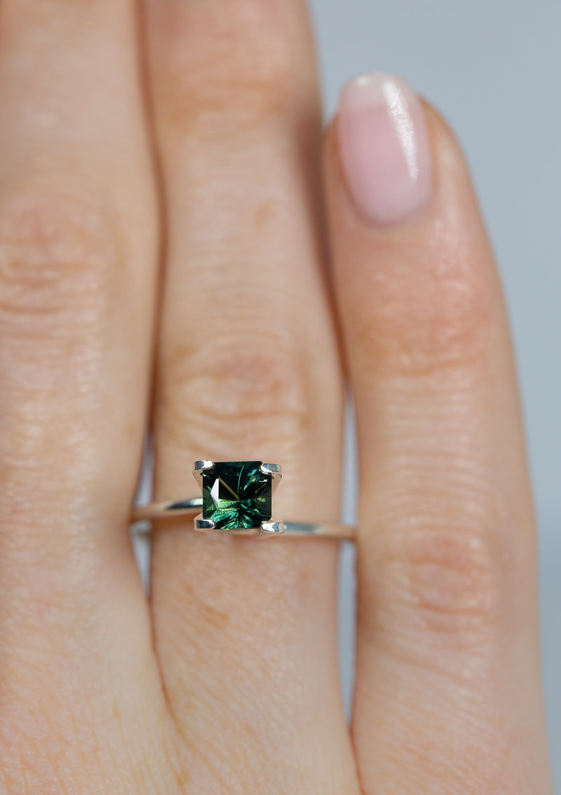 Magical 1.12Ct Blue Green Teal Sapphire | Emerald Shape from Madagascar on ring finger