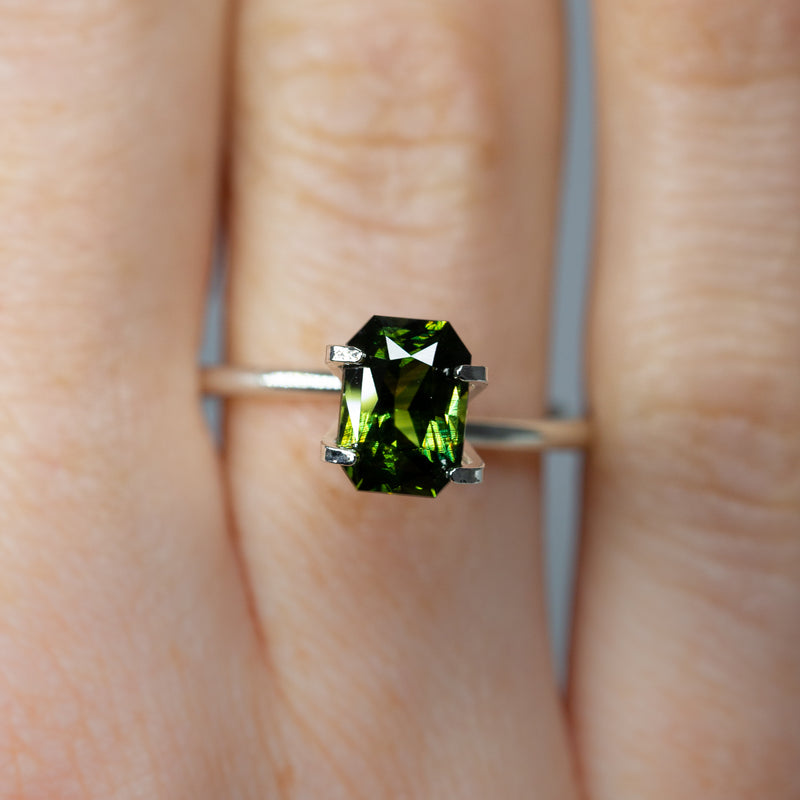 2.05Ct Forest Green Teal Sapphire | Emerald Shape from Madagascar on ring finger