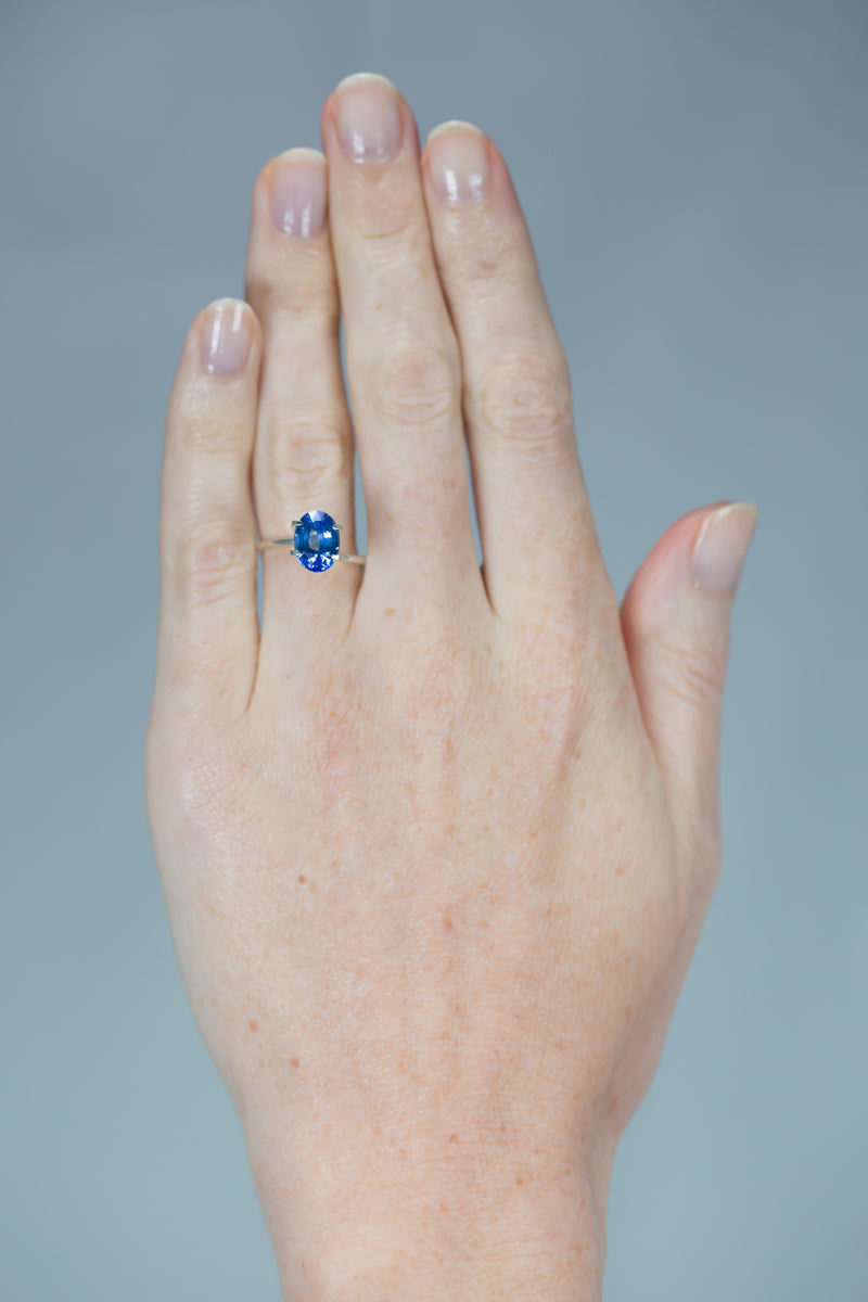 3.06Ct Vivid Sweet Blue Ceylon Sapphire | Oval Shape on hand