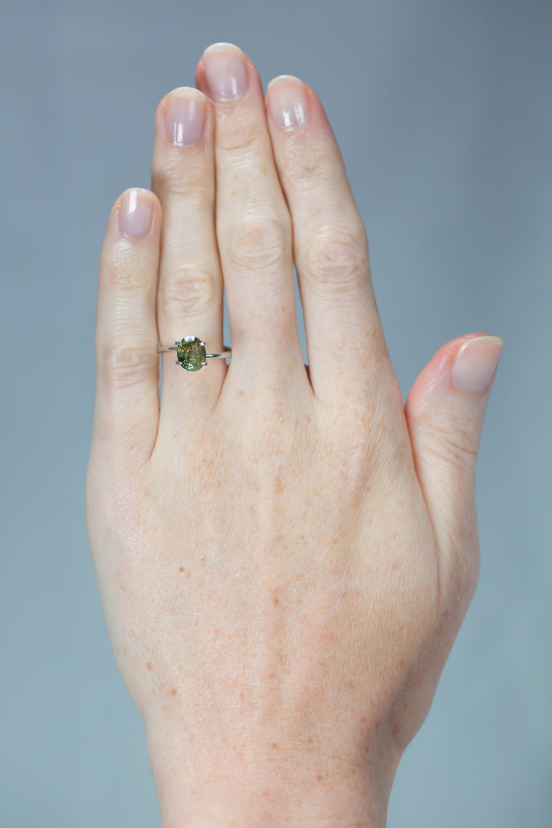 3.08Ct Yellow Green - Orange Red Ceylon Alexandrite | Oval Shape on hand