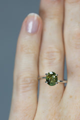 3.08Ct Yellow Green - Orange Red Ceylon Alexandrite | Oval Shape on ring finger