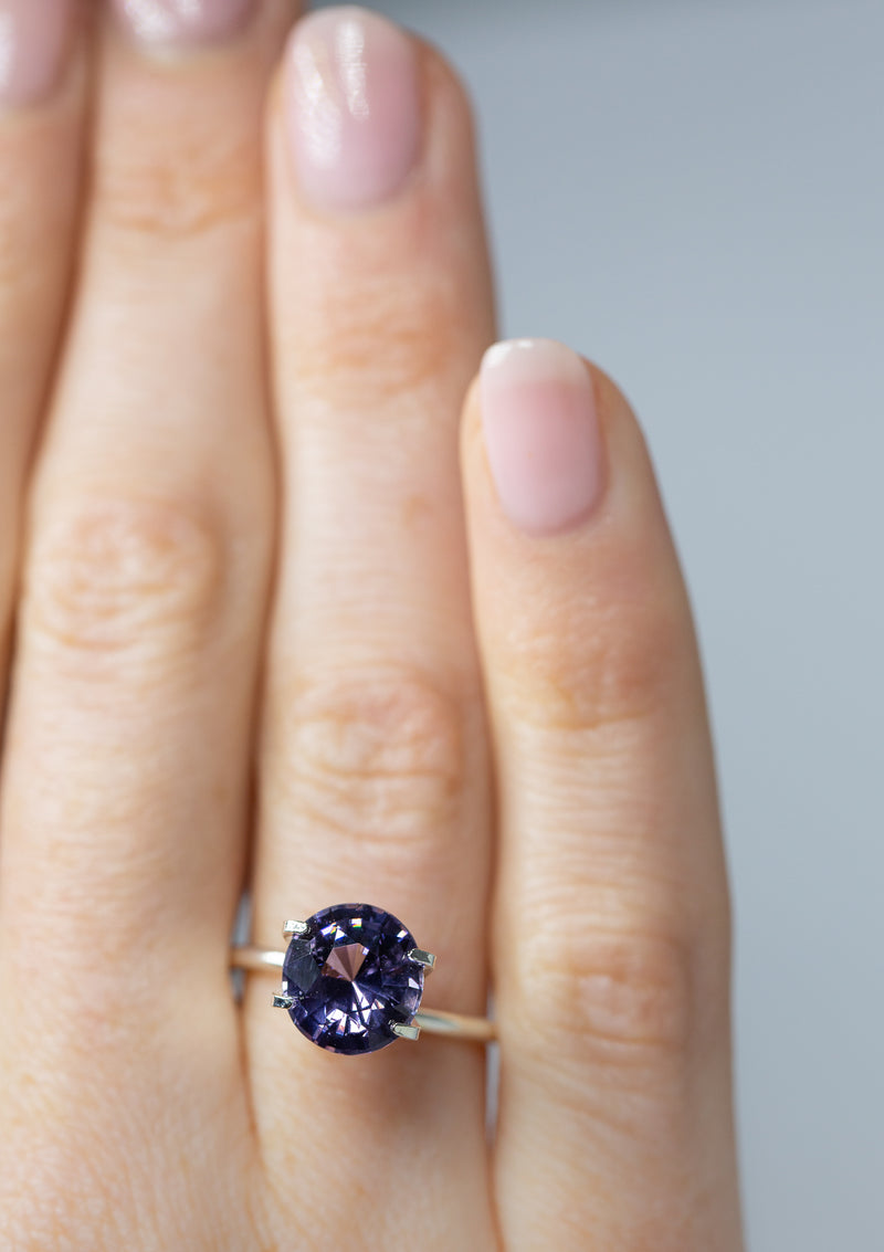 Lustrous 3.06Ct Lavender Spinel Oval Shape from Sri Lanka on ring finger