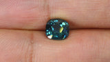 Video of 1.29Ct Blue Green Teal Sapphire | Cushion Shape from Madagascar between fingers